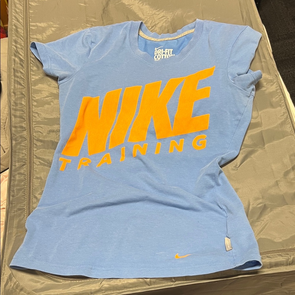 Nike Women's Light Blue Tee with Orange Logo